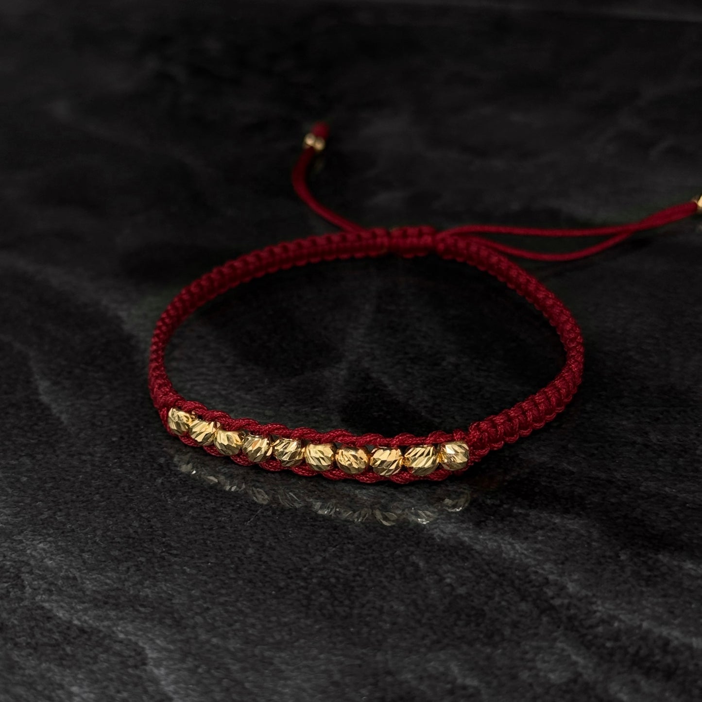 Pulsera Tejida / Balines Oro 18K