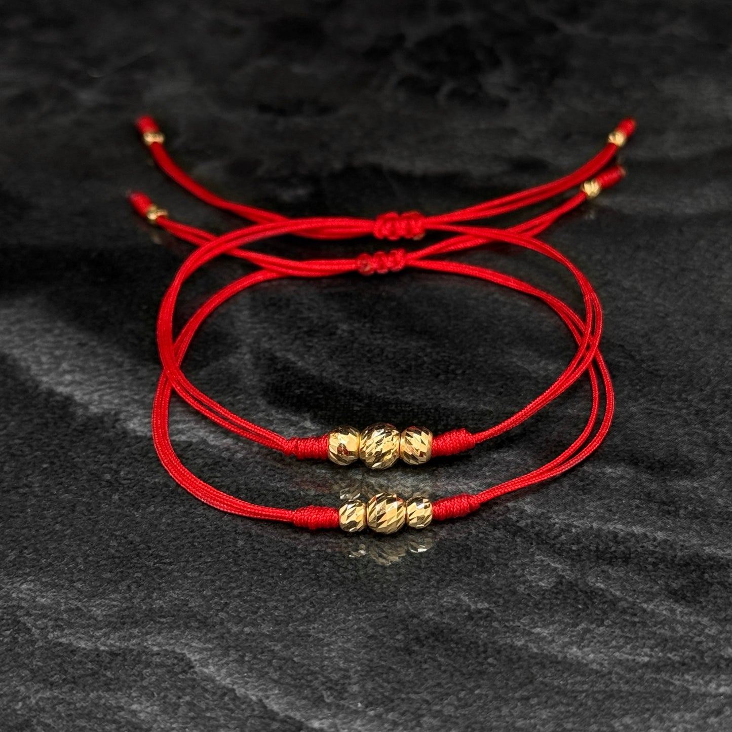 Dúo Pulseras Tejidas / Balines Oro 18K