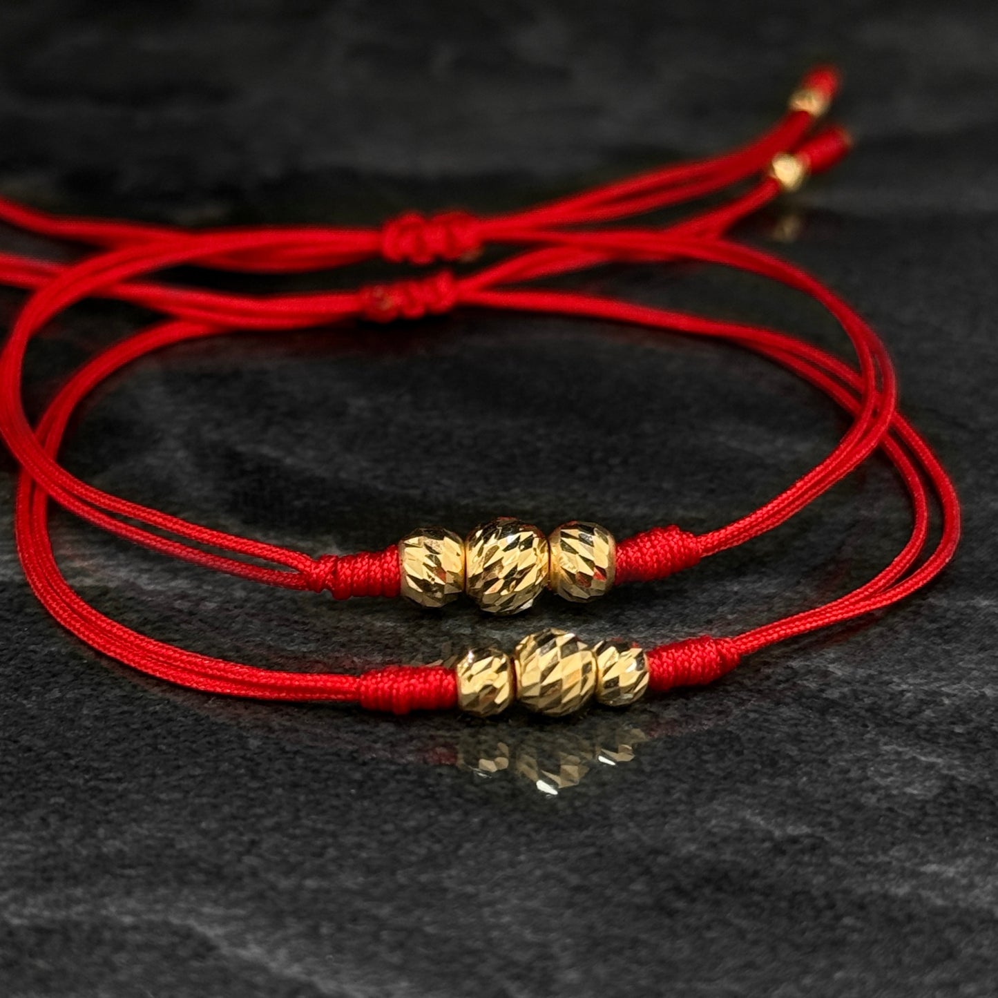 Dúo Pulseras Tejidas / Balines Oro 18K