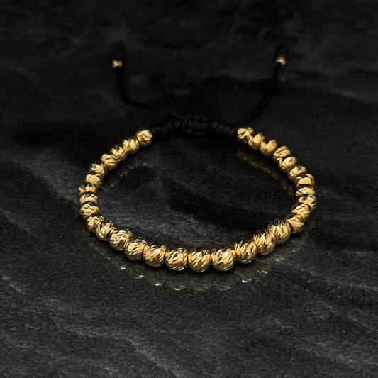 Pulsera Tejida de Lujo / Balines Oro 18K